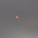I took this photo by holding my eclipse glasses up over my camera lens. I still can’t believe it worked.